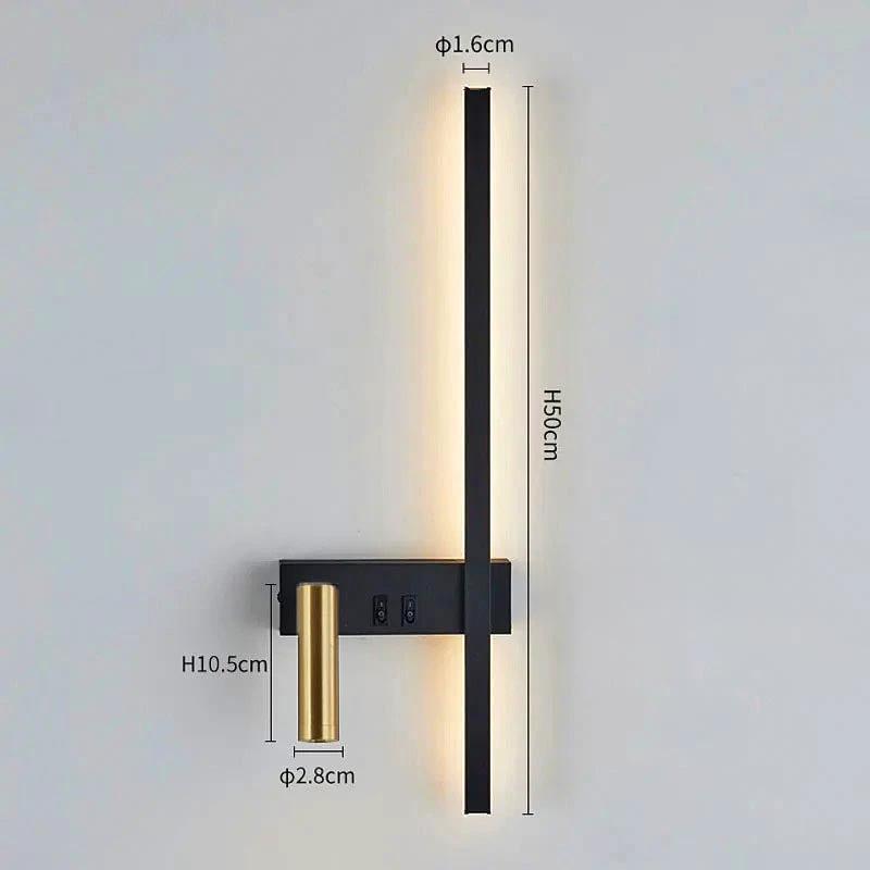 Swivel LED Wall Light with black body and brass accent mounted on a bedroom wall for reading.