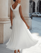Elegant chiffon draped-neck pleated midi dress for women by Christine Brewer, featuring flowing fabric and stylish design.