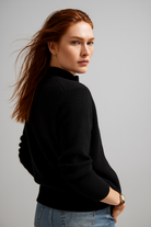 Women’s wool zip-up cardigan by Christine Brewer, stylish jean-inspired design with a comfortable fit and front zipper closure.