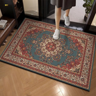 Decorative rug with intricate patterns on a wooden floor, person stepping onto it.