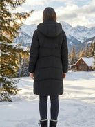 Close up view of the women's flattering quilted winter puffer jacket showing the intricate stitching and luxurious fabric texture in a rich navy color.