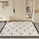 Black and white patterned rug on a floor with a mirror and wall hooks in the background.