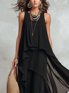 Black layered chiffon maxi dress by Christine Brewer featuring bohemian style and flowing fabric for elegant, relaxed wear.