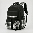 View of a stylish checkered school backpack featuring padded shoulder straps and a spacious compartment