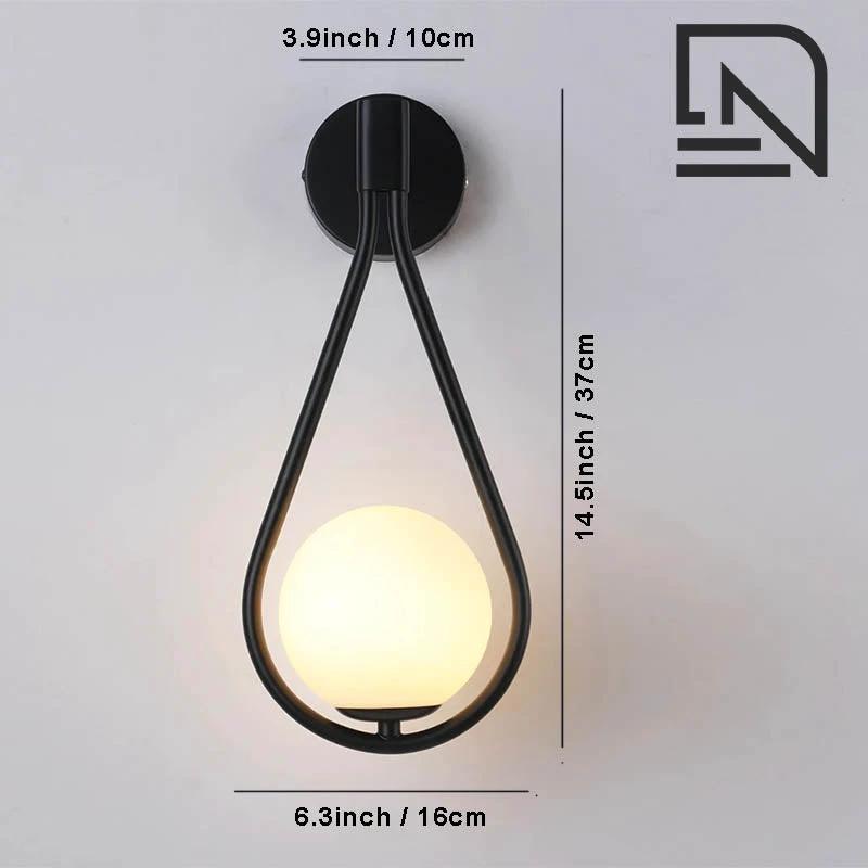 Wall light DARBE Nordic Brass with frosted glass globe, black teardrop frame, wall-mounted backplate