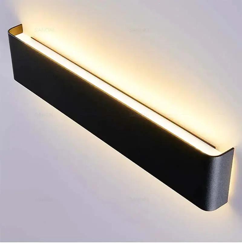 Minimalist LED Wall Light – Aluminium Up & Down Wall Lamp for Bedroom / LYST, black fixture emitting warm light up/down.