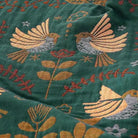 100% Cotton Reversible Throw Blanket, teal with gold and gray bird pattern.