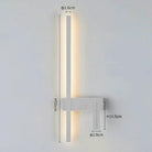 SVEA Swivel LED Wall Light, modern Nordic reading lamp for bedroom; white finish with warm LED glow beside bed.
