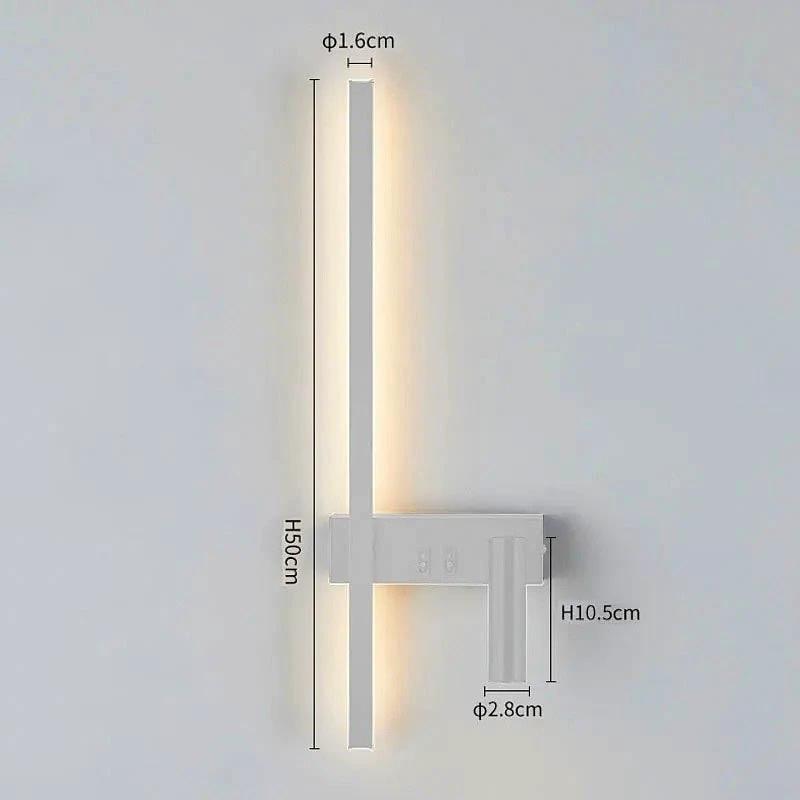 SVEA Swivel LED Wall Light, modern Nordic reading lamp for bedroom; white finish with warm LED glow beside bed.