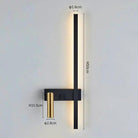 Swivel LED Wall Light with black body and brass accent mounted on a bedroom wall for reading.