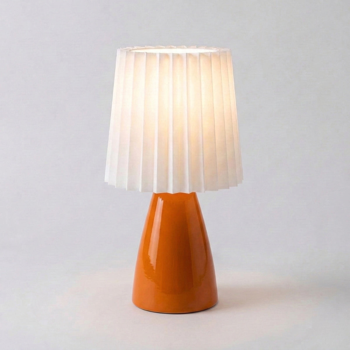 scandinavian ceramic pleated table lamp in orange