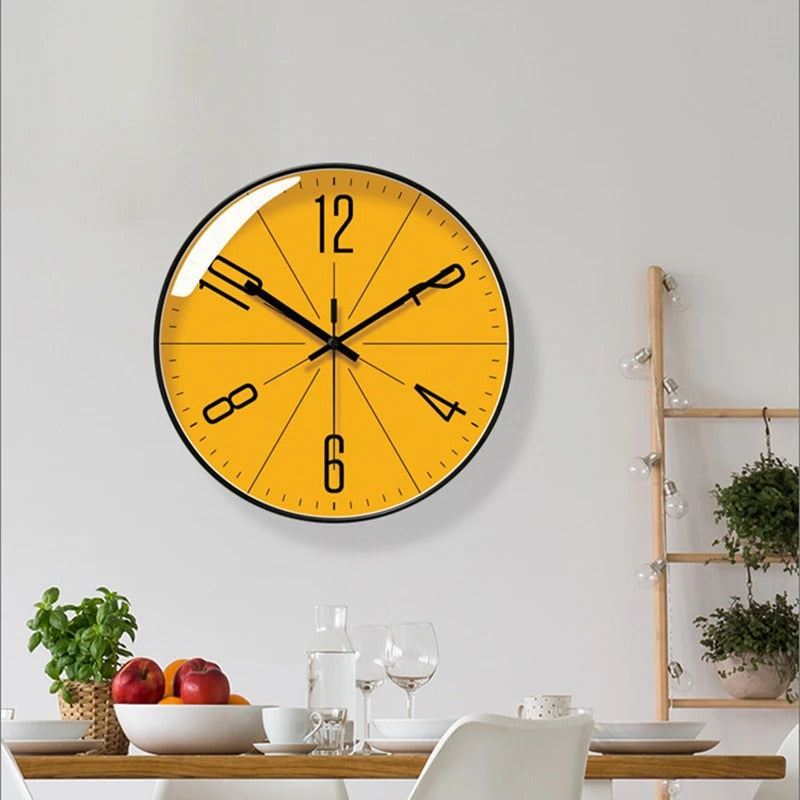 TIDEN – Nordic Modern Wall Clock, yellow dial with black hands, mounted above a dining table in a dining room.
