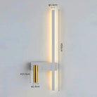 SVEA Swivel LED Wall Light on a bedroom wall, white finish with gold reading head, for directional bedside reading.
