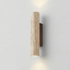 Cylindrical wall light fixture on a plain wall