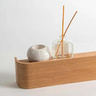 Wood & Iron Coat Rack with Hidden Hooks & Shelf mounted on a natural wood entryway wall for coats.