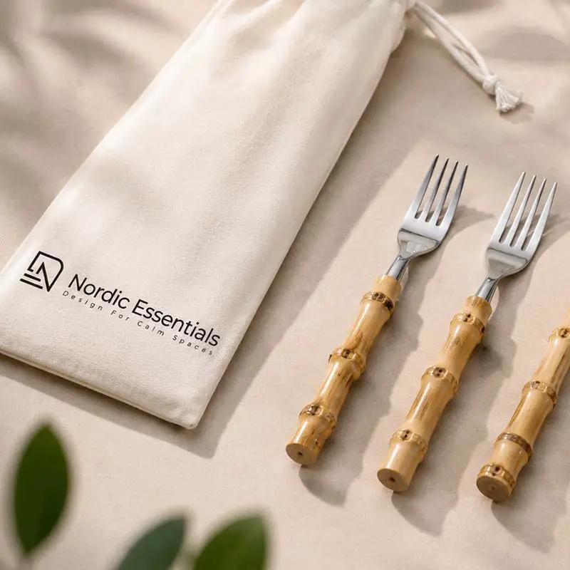 Cutlery set, 24-piece bamboo-handle stainless steel flatware by Nordic Essentials shown with a cloth bag