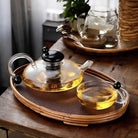 glass teapot set with cups in transparent