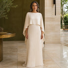 long wedding guest dress — Beige pleated cape maxi wedding guest dress complete front view