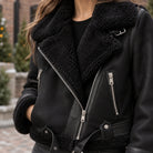 sherpa jacket — Women's Sherpa Lined Biker Jacket — Amira — Black — close up of the lapel and diagonal silver zip — view 10