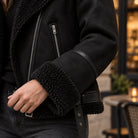 sherpa jacket — Women's Sherpa Lined Biker Jacket — Amira — Black — close up of the plush cuff and sleeve trim — view 12