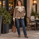 sherpa jacket — Women's Sherpa Lined Biker Jacket — Amira — Brown — full outfit while standing naturally by a — view 7